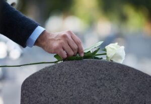 Paying,His,Respects.,Cropped,Shot,Of,A,Man,Placing,A
